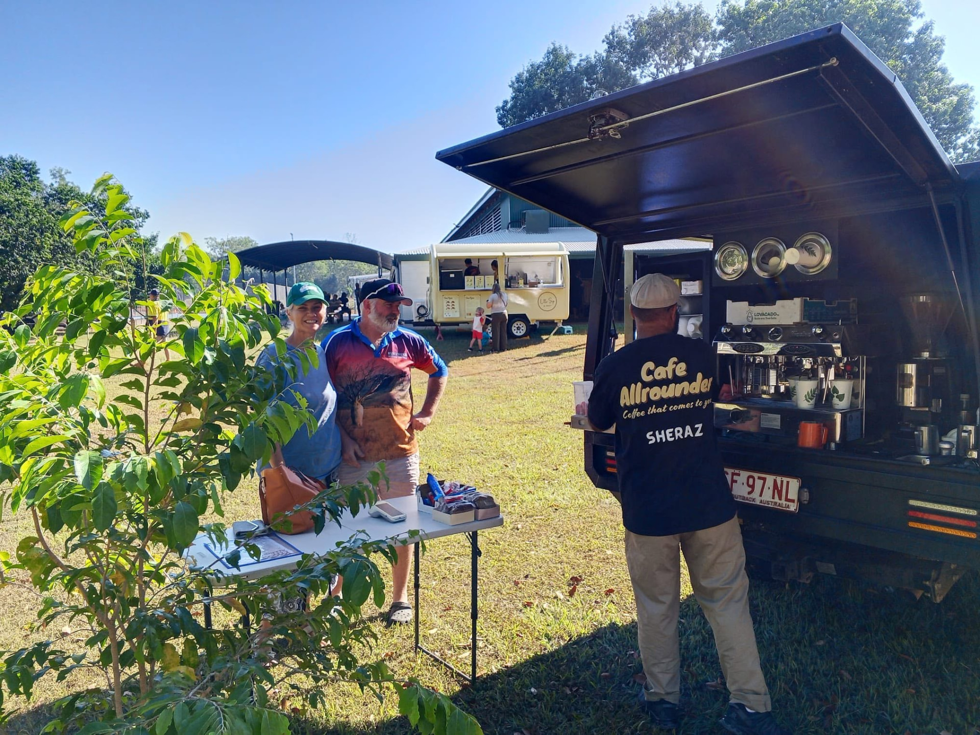 Customers being served Blacklist Premium Coffee from the Cafe Allrounder van